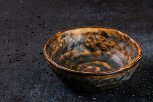 istock golden abstract pattern on surface of handmade ceramic dish that is similar on ocelot or tiger fur, print art stylized background texture with copy space 1289821562