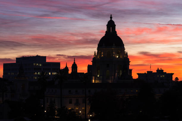 Pasadena, California, USA: image showing a silhouette of the Pasadena City Hall in the foreground photographed at dusk.. Pasadena is located in Los Angeles County, California.