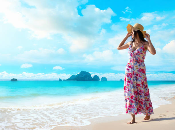 Asian beautiful woman walking on the beach