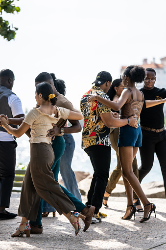 Miami Beach, FL, USA - December 6, 2020: Street photography couples dancing in the park Miami Beach scene