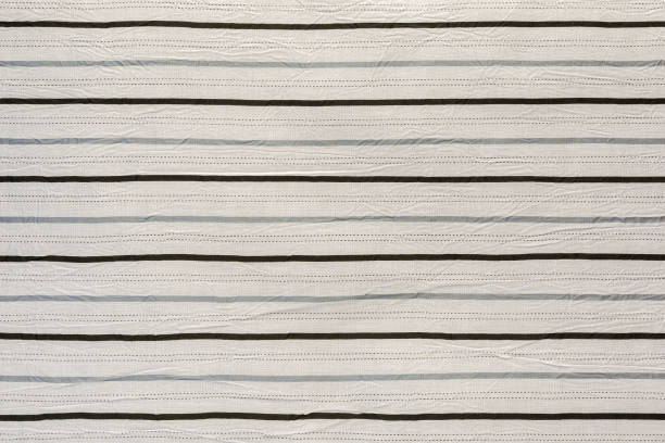 istock Cotton fabric with an abstract pattern in the form of horizontal stripes. 1289833978