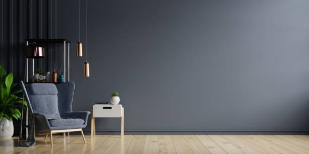 istock Interior of light room with armchair on empty dark wall background. 1289835776