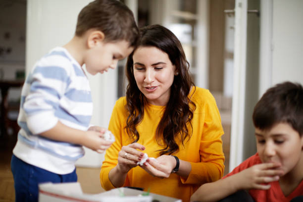 istock Happy mother having take out sushi with her two sons 1289838856
