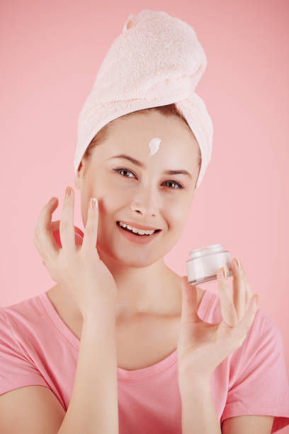 istock Woman applying moisturizing cream 1289840455