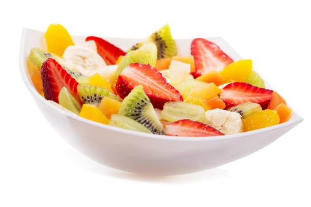 istock bowl of fruit salad on white background 1289846168