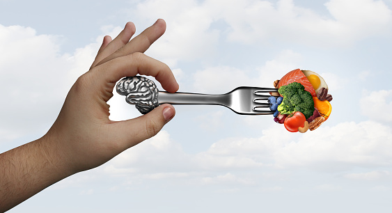Brain food nutrition concept as a group of nutritious nuts fish vegetables and berries rich in omega-3 fatty acids with vitamins and minerals for mind and memory health with 3D illustration elements.