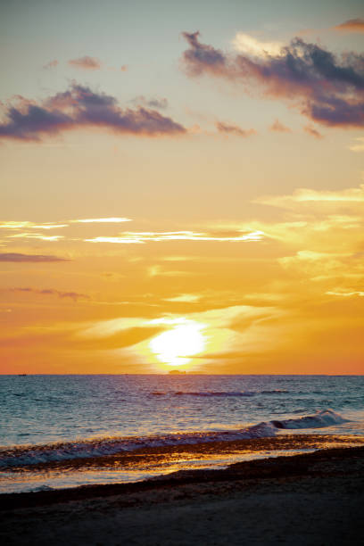 istock landscape with beach and clouds at sunset 1289851623