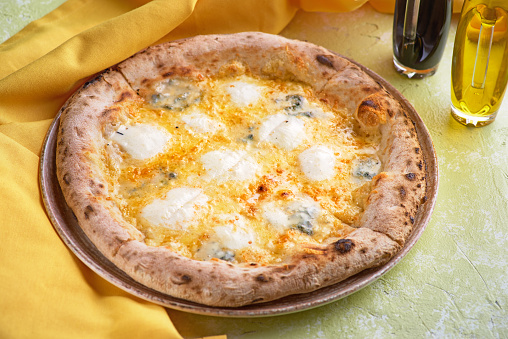 Pizza Quattro formaggi. Traditional italian cuisine. Concept of healthy eating for menu.
