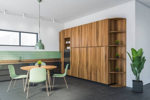 istock White and green dining room corner with bookcase 1289854176