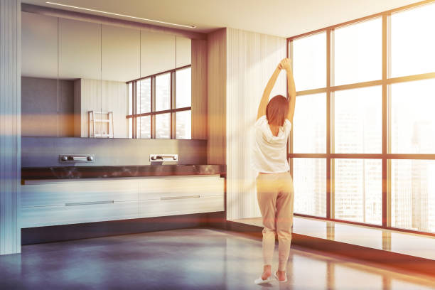 istock Young woman in panoramic white bathroom corner 1289854653
