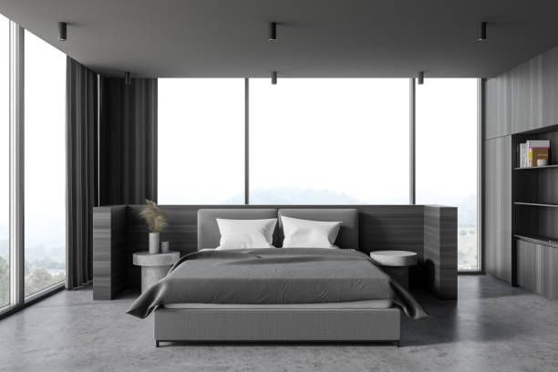 istock Modern wooden and gray master bedroom interior 1289855283