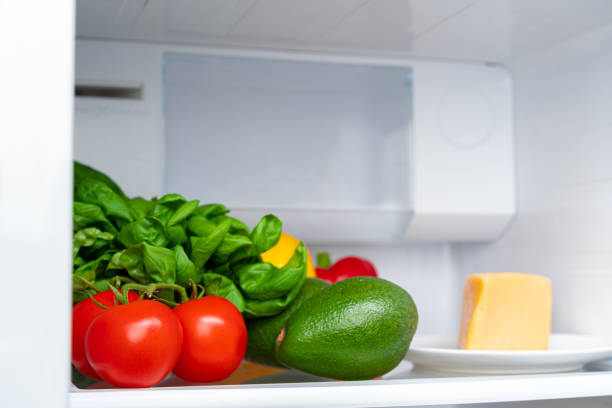 istock Fridge shelf full of fresh vegetables close up 1289855444