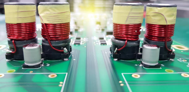 istock Electromagnetic coil, inductor on circuit board close-up 1289858958