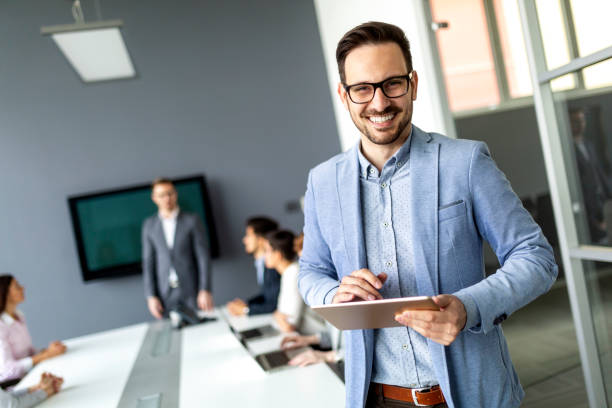 istock Business people having board meeting in modern office 1289859083