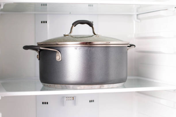 Pot with soup in the refrigerator, healthy food