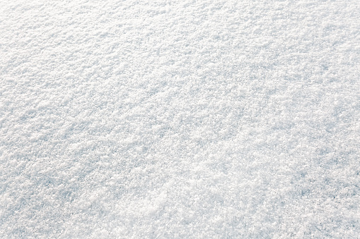 High angle view of snow texture close-up. Winter background.