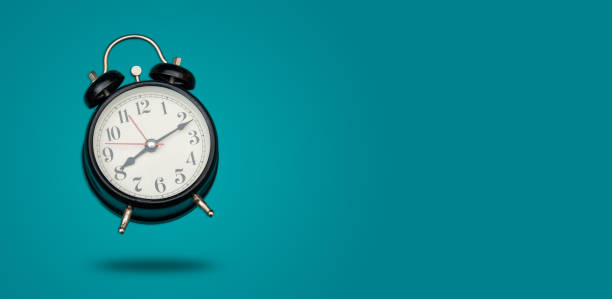 istock Black color clock hanging on banner template with space 1289863444