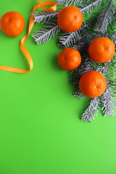 istock fir branches, Christmas toys and tangerines 1289864176