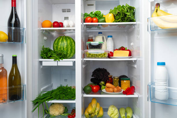 istock Open fridge full of fruits, vegetables and drinks 1289866167