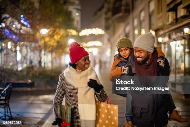 Family Christmas Shopping Stock Photo - Download Image Now - Retail, Shopping, Vacations