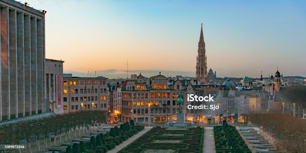 Sunset over the city center of Brussels seen from Mont des Arts hill Sunset over the city center of Brussels seen from Mont des Arts hill, with the tower of the Brussels town hall in the middle. Brussels is the capital of Belgium. Brussels-Capital Region Stock Photo
