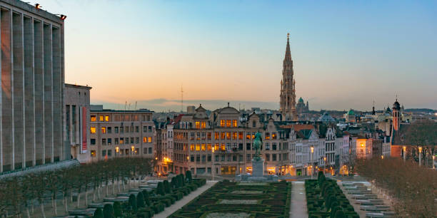 Sunset over the city center of Brussels seen from Mont des Arts hill Sunset over the city center of Brussels seen from Mont des Arts hill, with the tower of the Brussels town hall in the middle. Brussels is the capital of Belgium. brussels capital region stock pictures, royalty-free photos & images