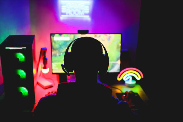 Streamer gamer playing at strategy game in broadcast browser - Young man having fun gaming and streaming online - New technology game trends and entertainment concept - Focus on his head