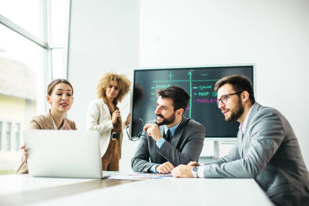 istock Group of business people working inside modern office 1289876083