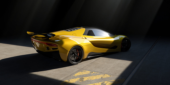 A generic yellow sports car parked at a angle, facing away from the camera in a large garage with a concrete floor containing some worn yellow painted stripes. The car is illuminated by a single skylight above it through which subtle shafts of light emanate.