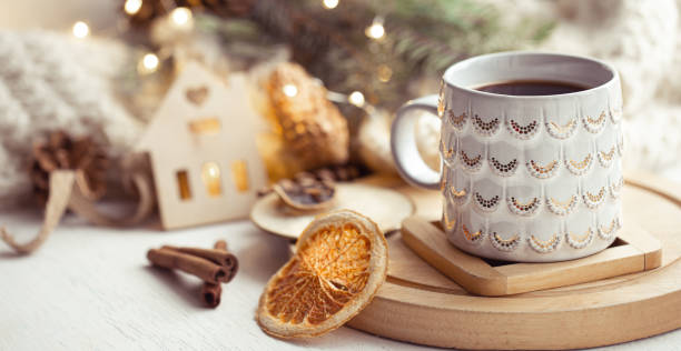 istock Beautiful cup with hot drink close up on blurred background with bokeh lights. 1289887954