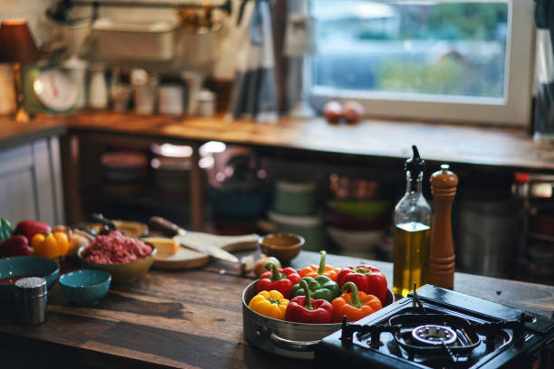 istock Preparing Stuffed Bell Peppers with Ground Meat in Tomato Sauce 1289889266