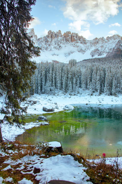 istock landscape with mountains, carezza lake, fir trees and clouds 1289890476