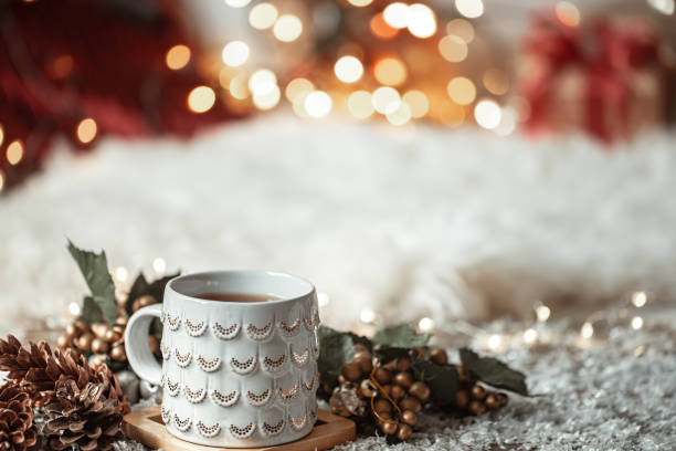 istock Cozy winter background with a beautiful cup on a blurred background with bokeh. 1289890537