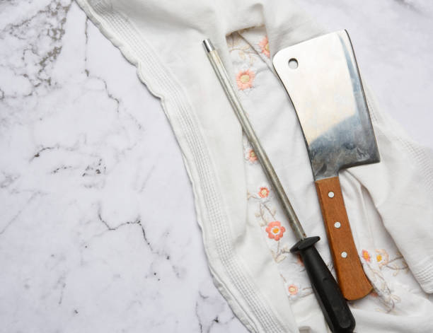 istock knife and old iron sharpener with handle for kitchen knives on a white background 1289890784
