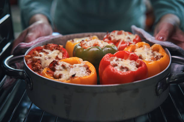 Baking Stuffed Bell Peppers with Ground Meat in Tomato Sauce