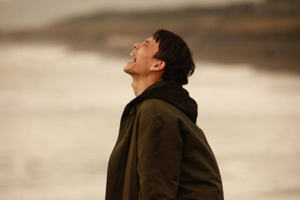 A man yelling at the sea
