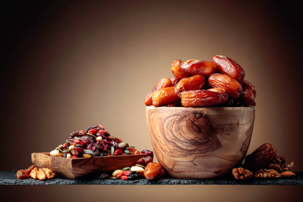 Healthy dried nuts and fruits in wooden bowl. Roasted Cashew Nuts.