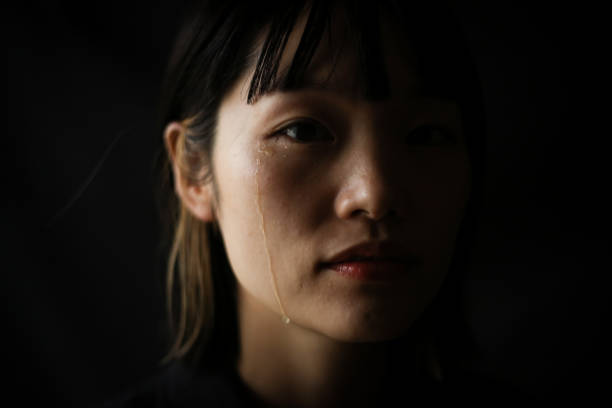 istock Woman shedding tears 1289893338