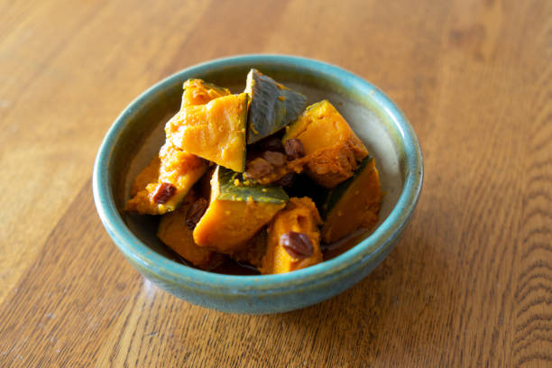 Japanese food - Simmered Kabocha Squash - Vegan food Japanese food.
Simmered Kabocha Squash. Vegan food.
Simmered pumpkin with raisins.
A taste of mother's cooking.
Healthy Japanese food culture.
Served on a deep ceramic plate. kabocha stock pictures, royalty-free photos & images