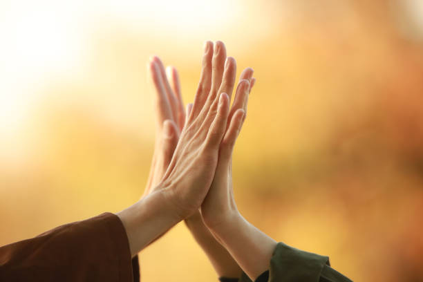 istock High five male and female hands 1289898357