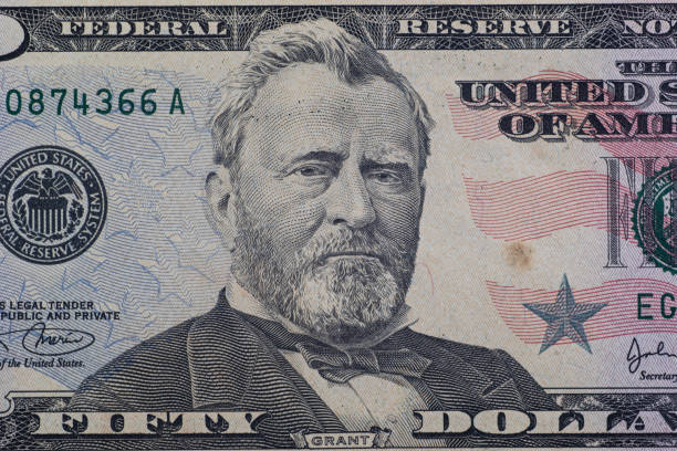 istock Close up detail on American Dollars banknotes 1289898983