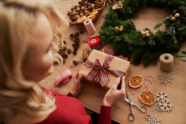istock Top view of woman with Christmas gift ready 1289900694