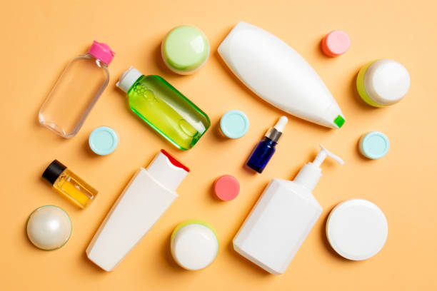 istock Group of plastic bodycare bottle Flat lay composition with cosmetic products on colored background empty space for you design. Set of White Cosmetic containers, top view with copy space 1289901931