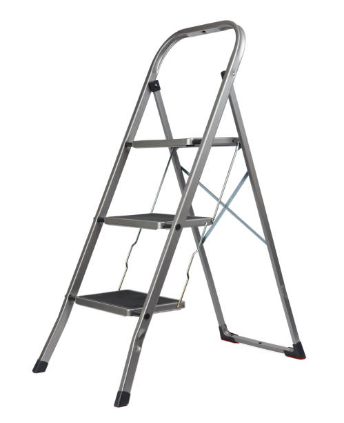 Man climbing a ladder on a water storage tank.