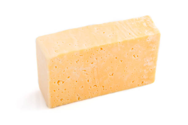 istock Piece of yellow cheese isolated on white background. Side view, close up. 1289903684