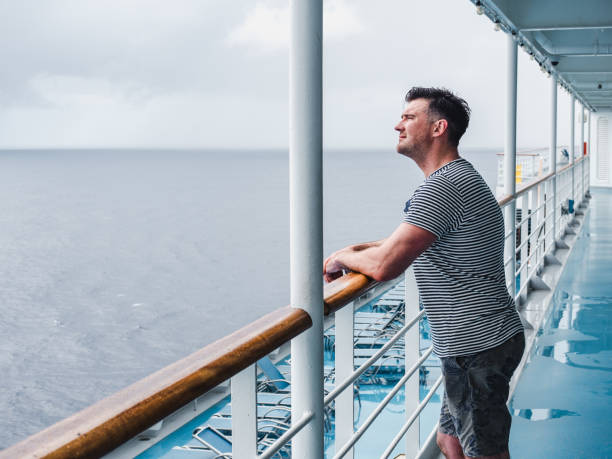 istock Fashionable man on the empty deck of a cruise liner 1289905268