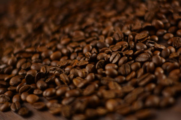 istock Natural roasted coffee beans on a wooden table 1289909211