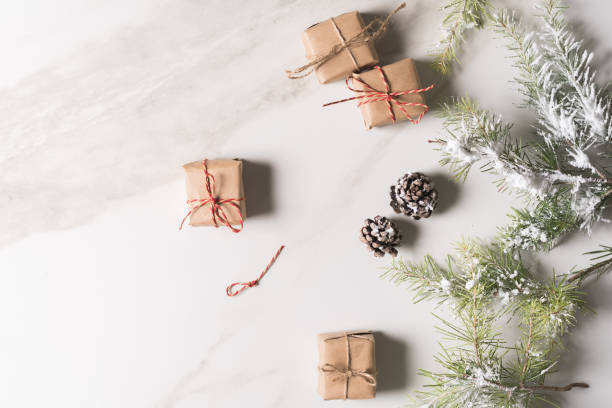 istock Christmas background with gift boxes, red ribbon, winter decorations, isolated on white background. 1289909862