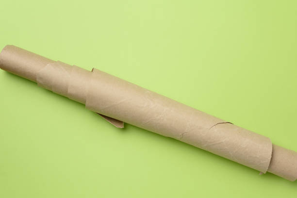 istock roll of brown parchment paper on a green background 1289910243