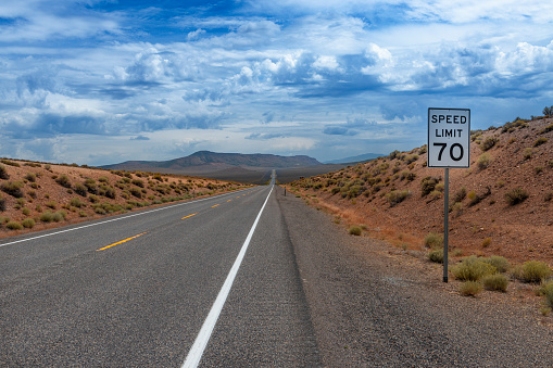 View of the US route 50 (known as the Loneliest Road in America) in the State of Nevada, USA. Concept for travel in America and road trip.
